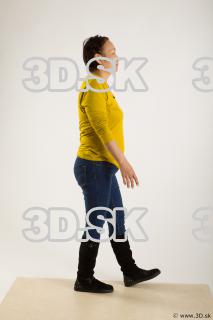 Walking reference of yellow sweater blue jeans Gwendolyn 0009